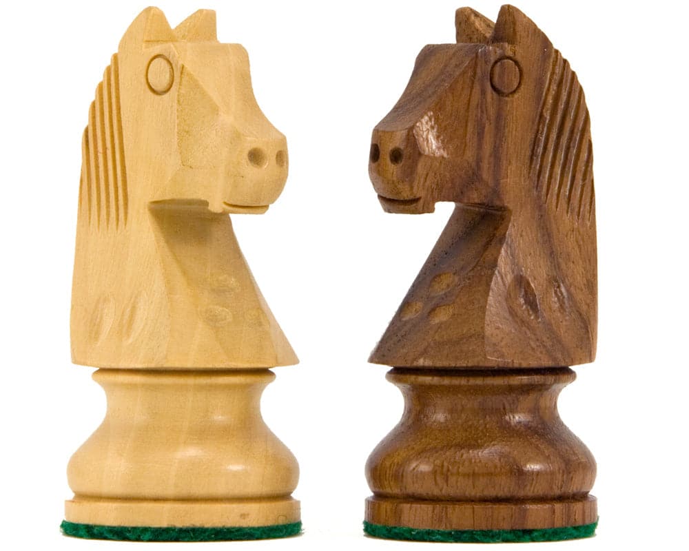 Sheesham and boxwood Down Head Knight chess pieces on white background.