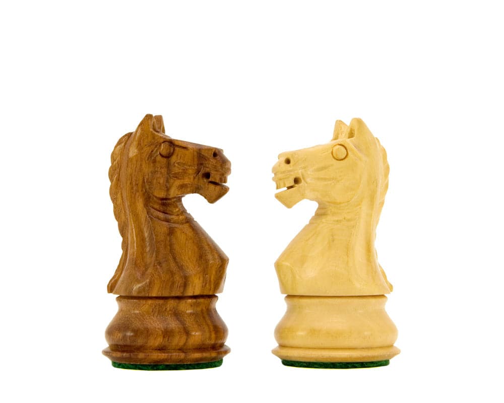 Two intricately crafted Staunton knight chess pieces in sheesham and natural boxwood.