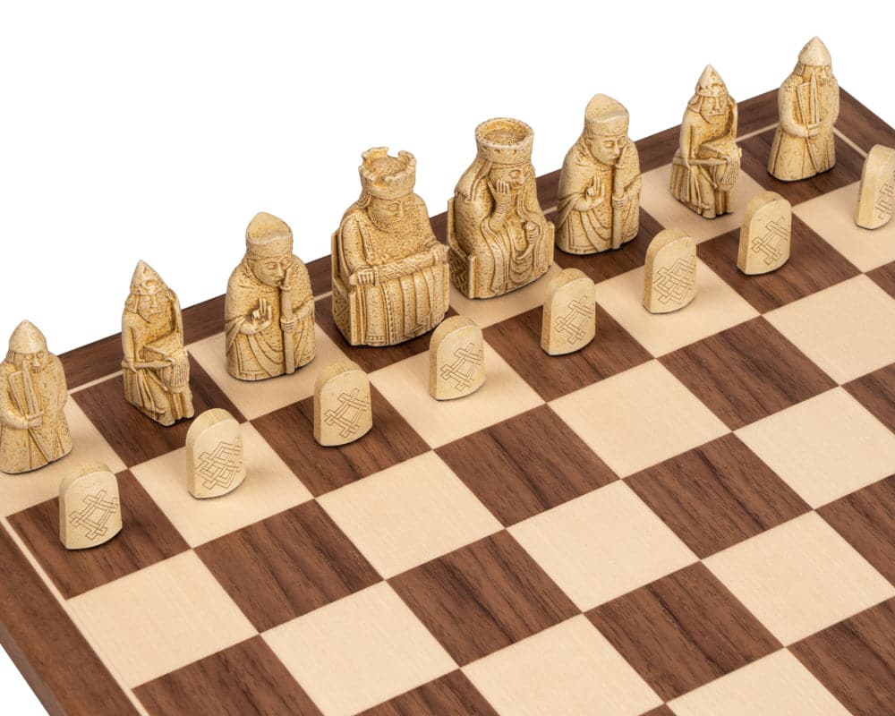 Lewis chessmen pieces on a chessboard, featuring a 2.75 inch King, beautifully crafted in the UK near Devon and Somerset.