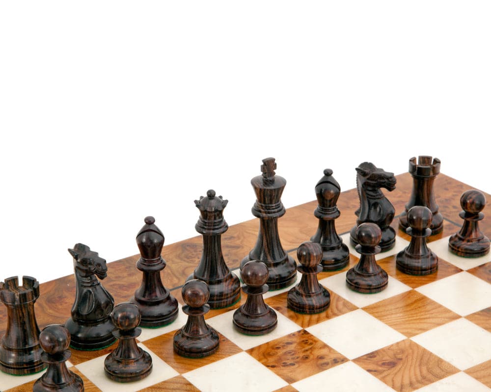 Rosewood Staunton Deluxe Chessmen 3.75 inches on a chessboard, showcasing hand crafted and intricately detailed pieces made from exotic rosewood.