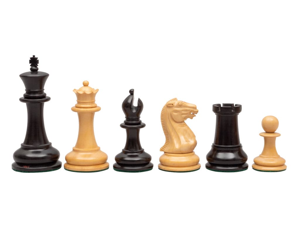 1851 Reproduction Staunton Ebony Chessmen 4.4 inch â€“ High-quality, handcrafted chess pieces in ebony and boxwood with detailed finish and felted bases.