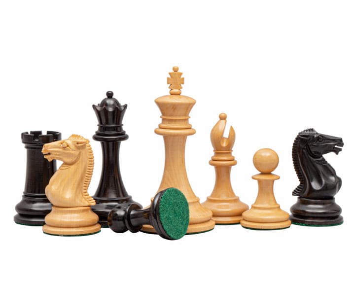 The Rochester Ebony Chessmen 4 inch, beautifully crafted in Spain, displayed on a high-quality 19 inch veneer chess board with notation markings.