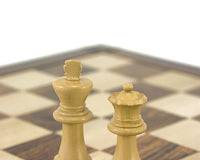 Down Head black chess king and queen pieces on European chess board
