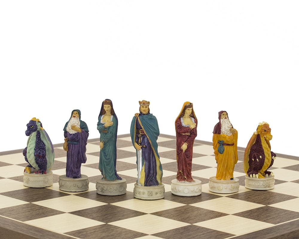 Hand painted medieval chess pieces on Spanish board, featuring beautifully detailed kings and queens in rich colors of red, blue, purple, and orange.