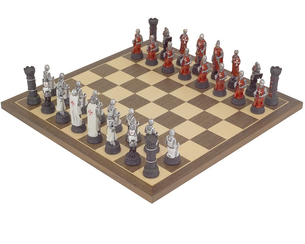 The Crusader Hand Painted Chess Set by Italfama with detailed knight and bishop pieces on a wooden chess board.