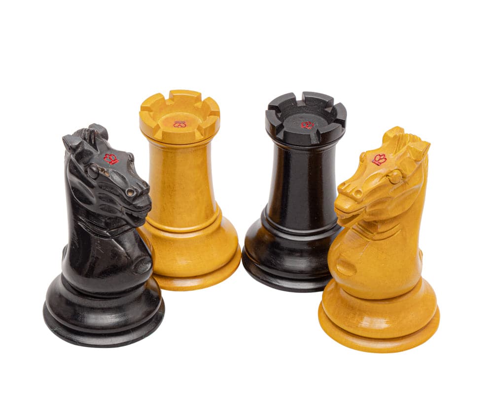 Hand turned carved boxwood chess pieces from The Harrwitz Black and Anegre Staunton Chess Set with antiqued and ebonised finish.