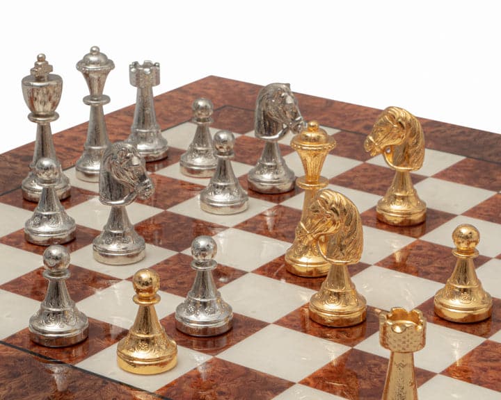 Luxury Italian chess set with gold and silver plated pieces on briarwood and elm board with billiard cloth bases.