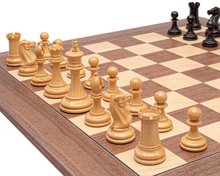 The Rochester Ebony and Walnut Grand Chess Set with classic Staunton design, 4 inch king, weighted pieces, and 23.6 inch Spanish board