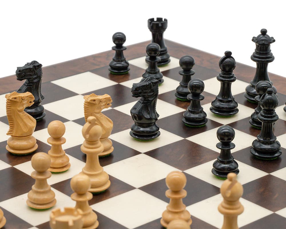 Close-up of Kingsclere Ebony and Walnut Luxury Chess Set on a 20-inch wooden chess board with high-quality Walnut and Maple veneers.