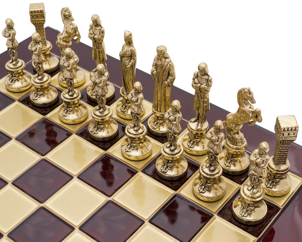 The Manopoulos Renaissance Chess Set with elaborate gold-colored chess pieces on a wooden chessboard.